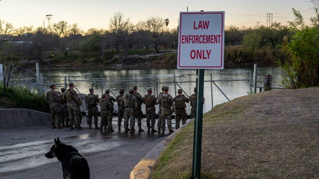 National Guard soldiers stand guard on the banks of the Rio Grande river at Shelby Park on Jan. 12, 2024, in Eagle Pass, Texas. 