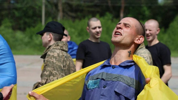 Ukrainian POWs are seen after a swap at an unknown location in Ukraine 